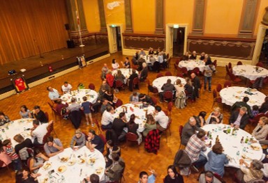 Round tables filling the floor of Fremantle Town Hall during the third charity dinner