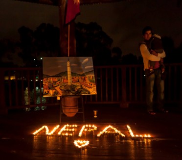 Candles arranged to spell the word Nepal at the memorial vigil