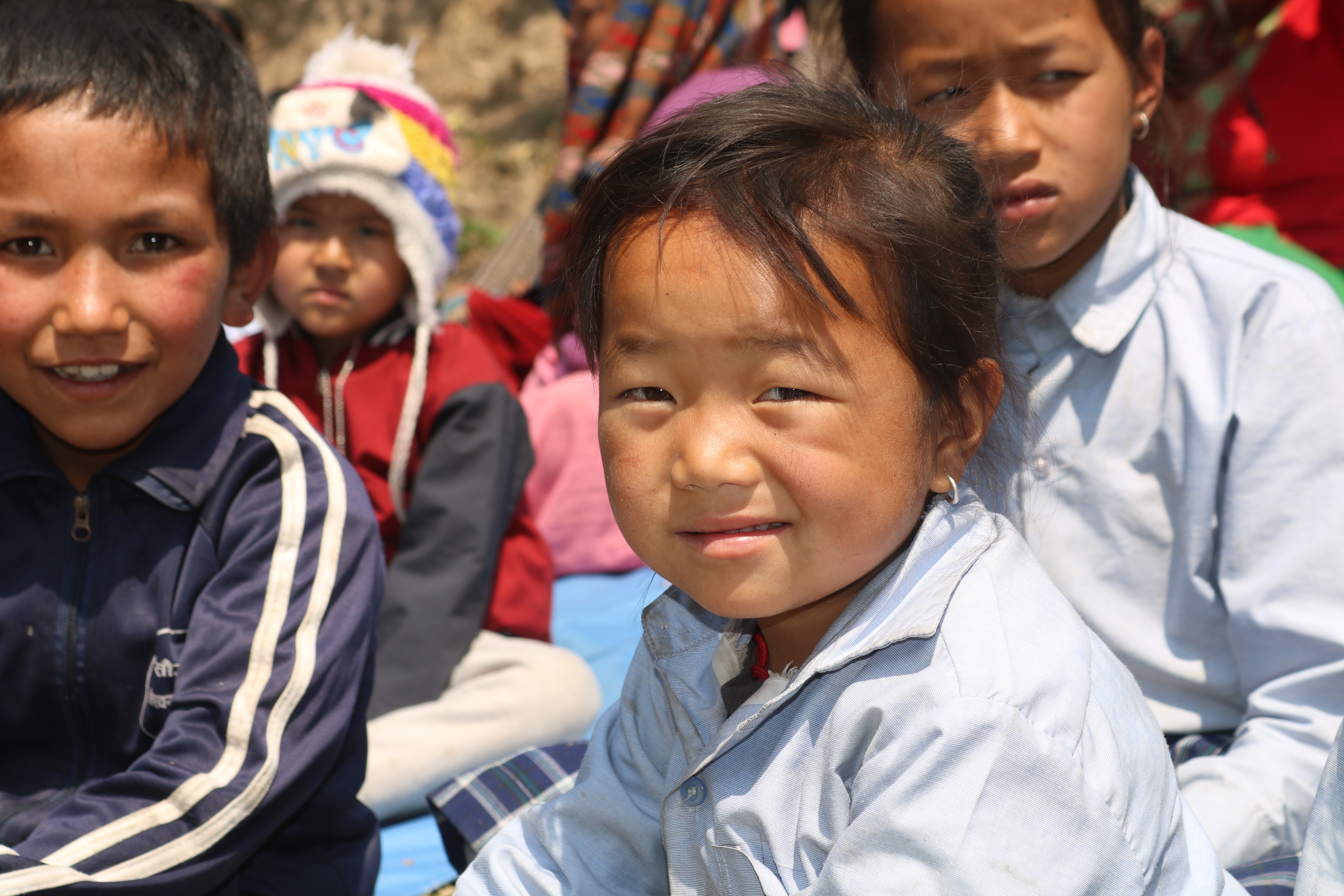 Relief distribution under a We Care Nepal Perth Australia banner in Bara district