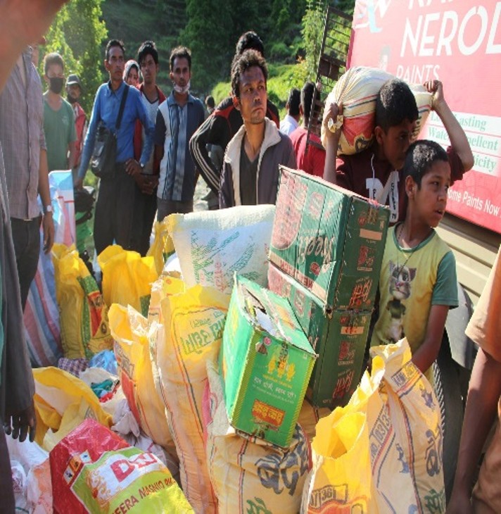 Volunteers unloading relief supplies from a truck in Nepal
